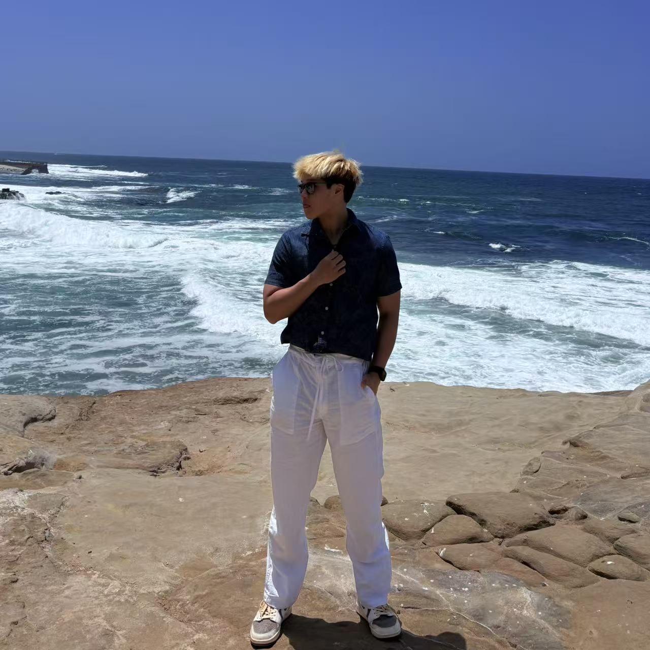 Xuming Huang at the coast